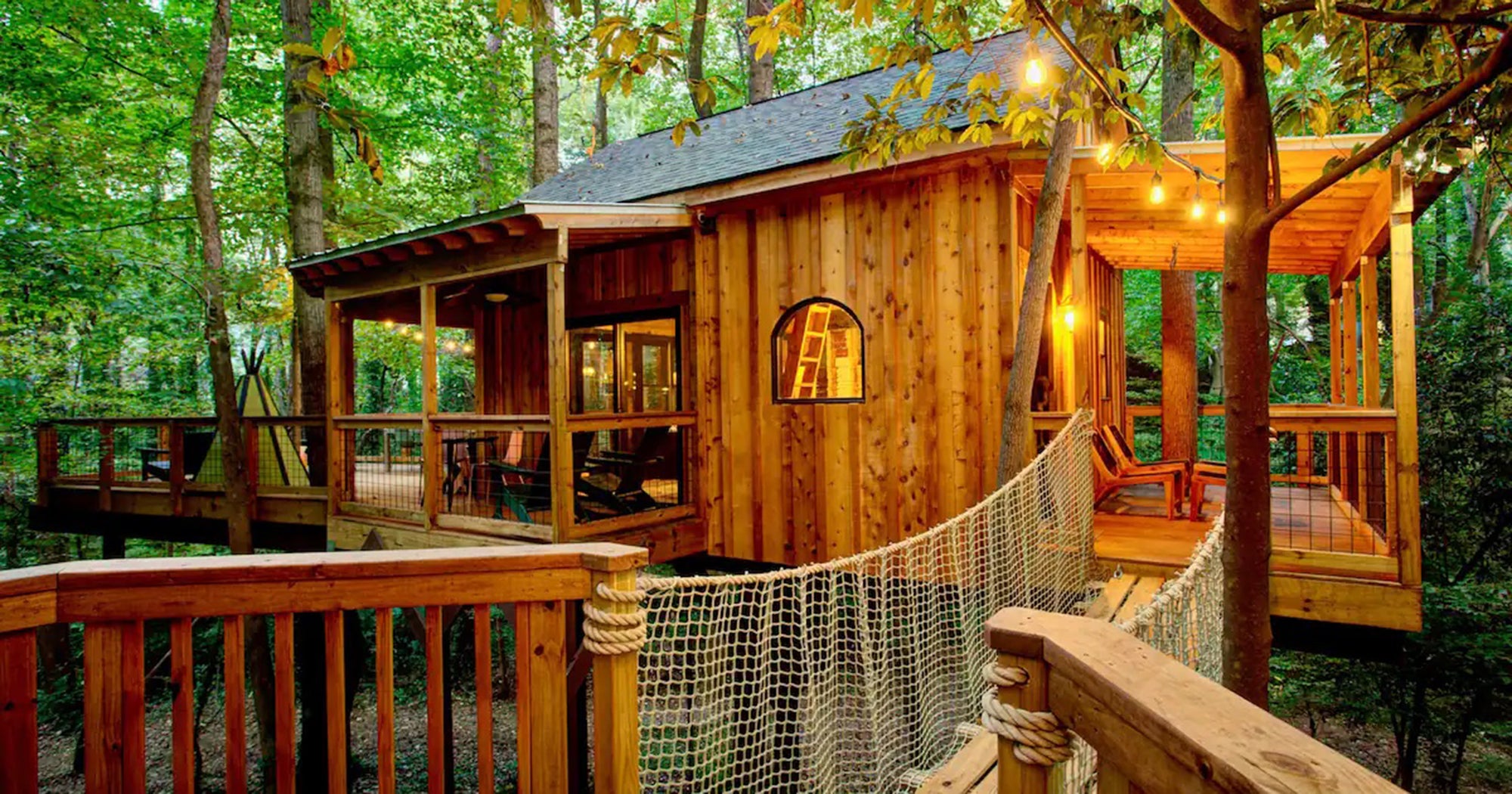 A cozy treehouse Airbnb nestled in the Virginia mountains with autumn leaves.