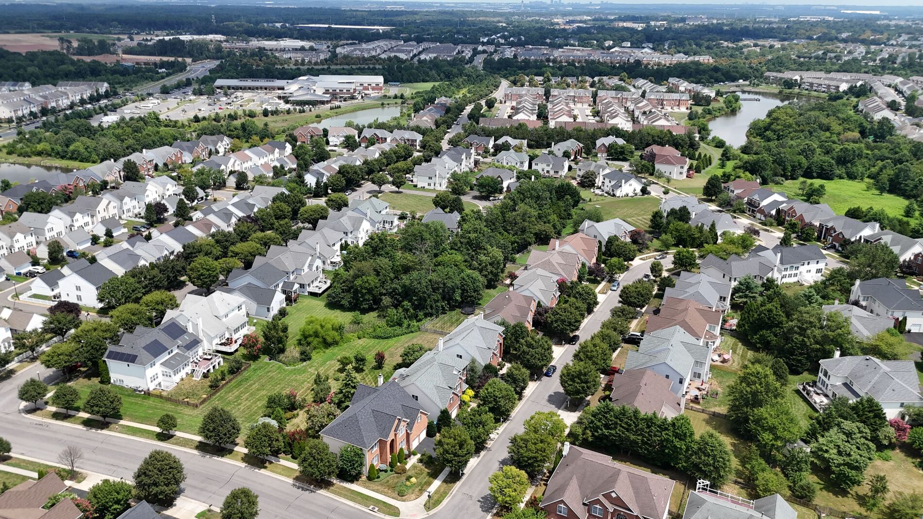 An aerial image of single family homes and mature trees in South Riding, VA