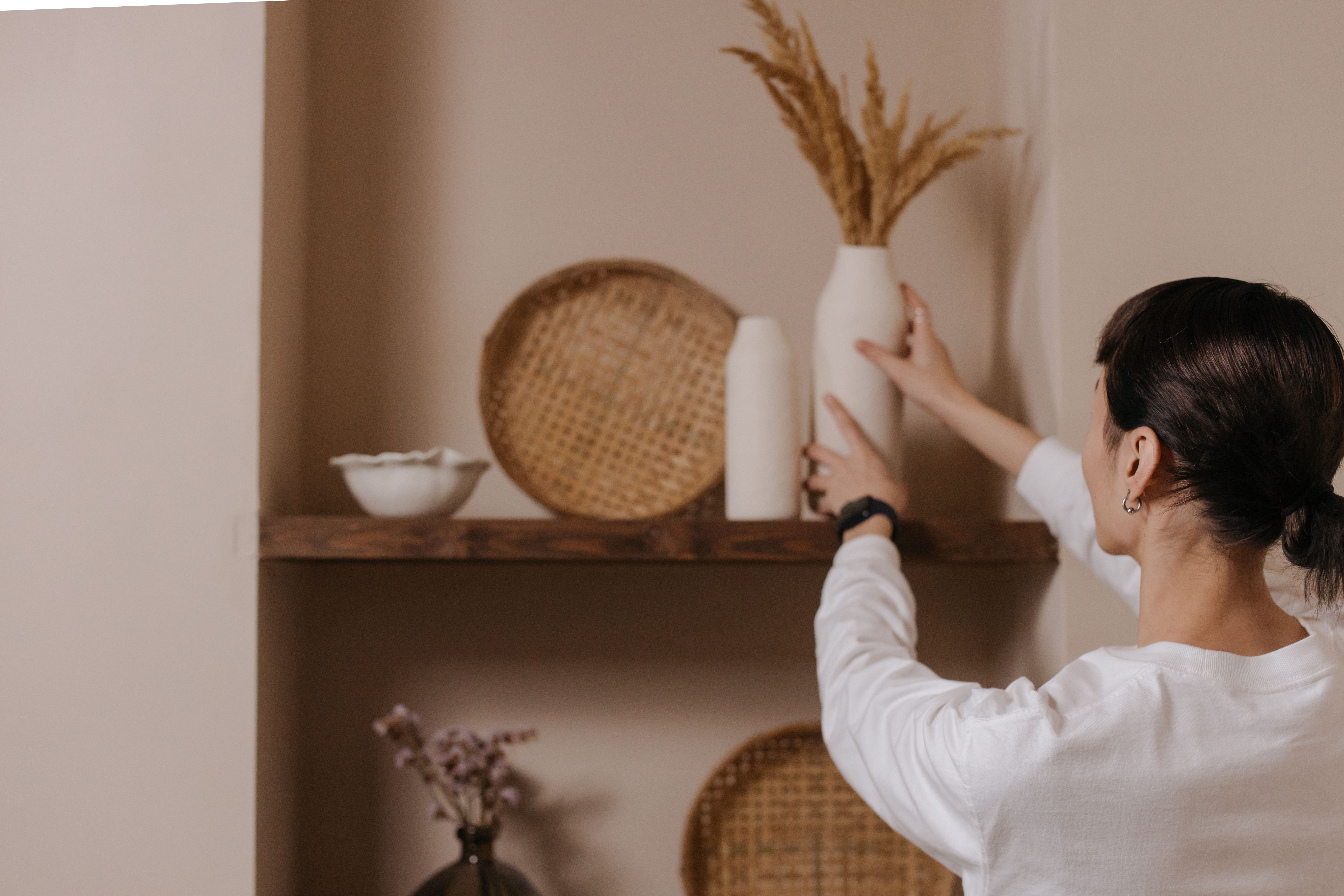 Woman staging interior decorations at Virginia home