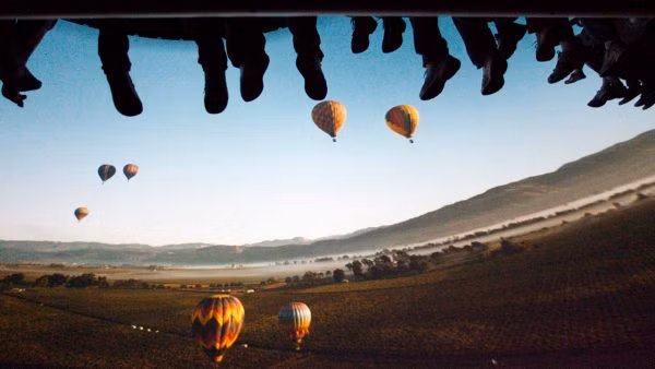 Riders on the Soarin' attraction, a concept that shared technology with rides planned for Disney's America.